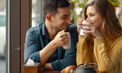 A happy couple having tea